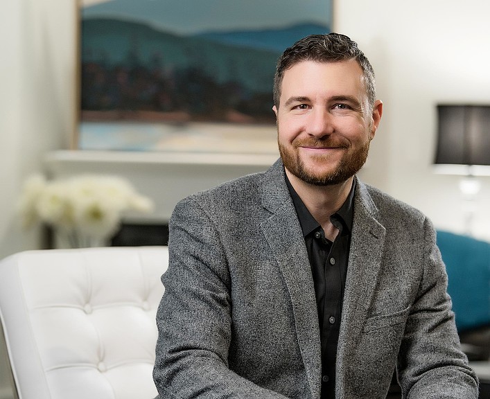 A man sitting on a couch.